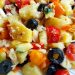 Country potato salad with tomato, red pepper, olives